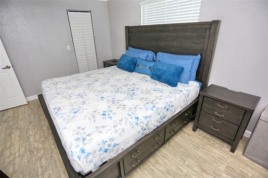 6960 Southwest 1st Street Margate, FL 33068 - Photo 28 of 36 a bed sitting in a bedroom next to a window