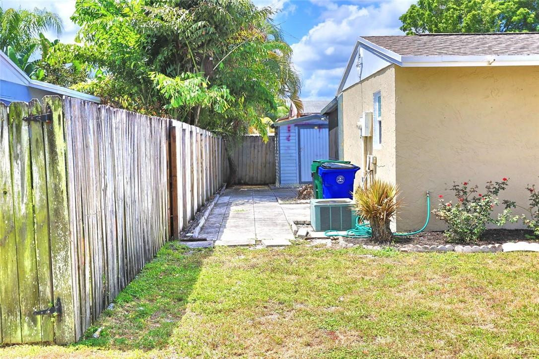 6960 Southwest 1st Street Margate, FL 33068 - Photo 30 of 36 a view of a backyard of the house