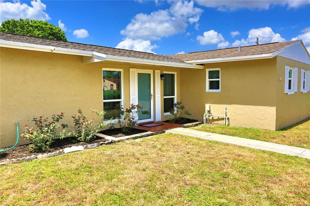 6960 Southwest 1st Street Margate, FL 33068 - Photo 3 of 36 a front view of a house with a yard