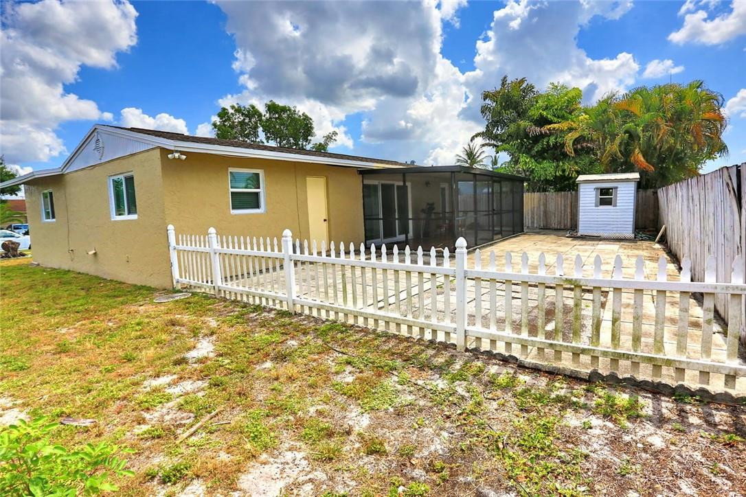 6960 Southwest 1st Street Margate, FL 33068 - Photo 36 of 36 a front view of a house with a yard