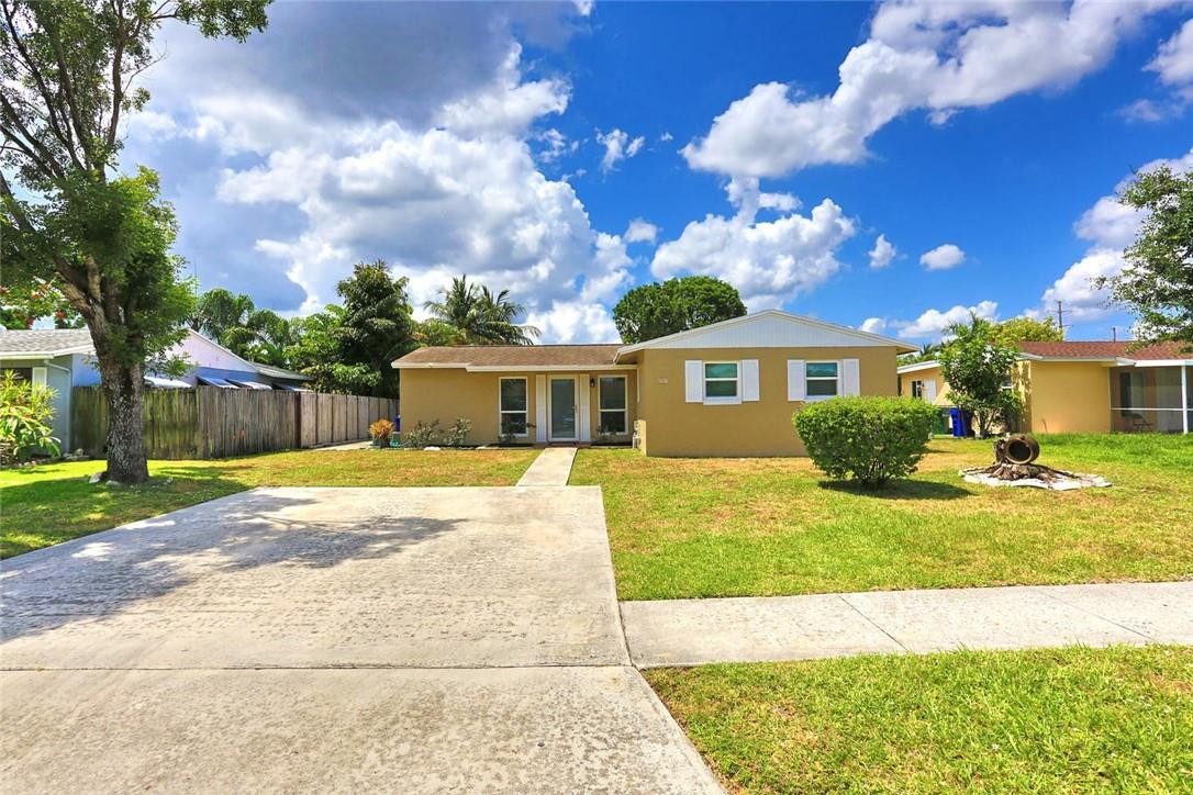 6960 Southwest 1st Street Margate, FL 33068 - Photo 4 of 36 a view of a house with backyard and a tree