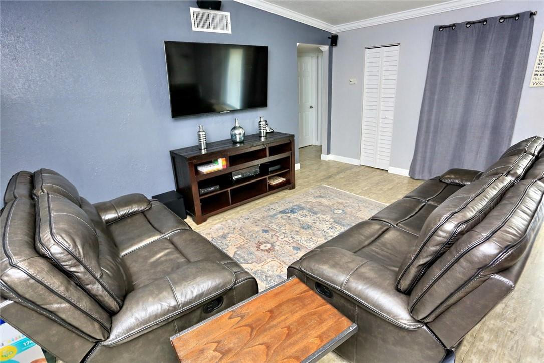 6960 Southwest 1st Street Margate, FL 33068 - Photo 8 of 36 a living room with furniture and a flat screen tv