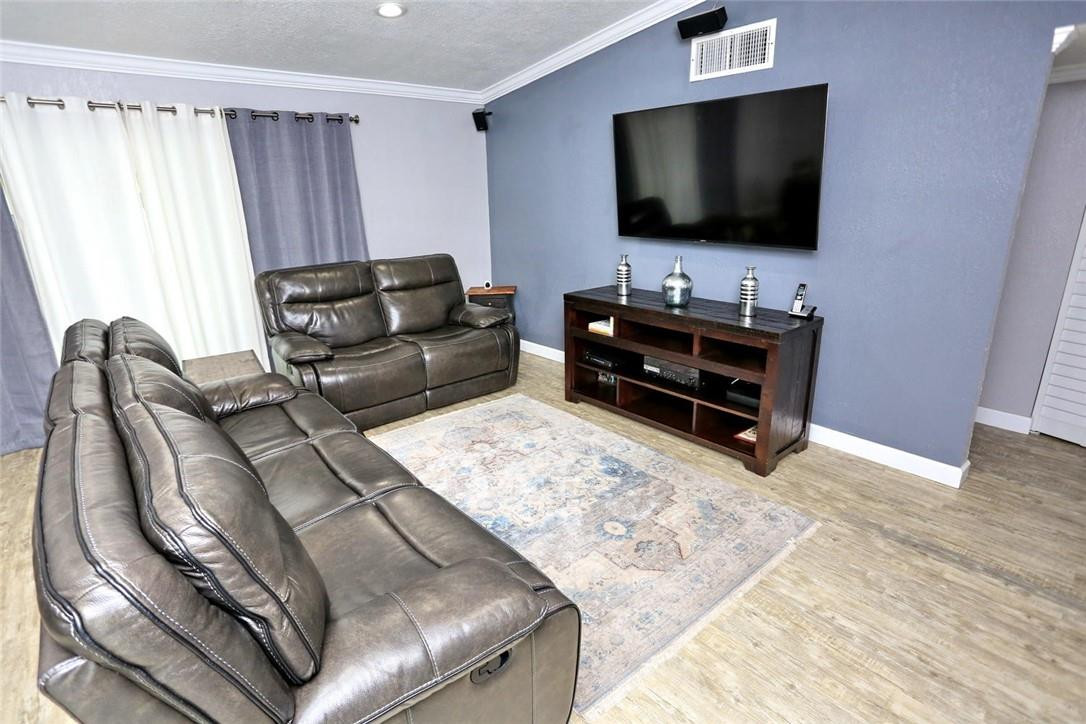 6960 Southwest 1st Street Margate, FL 33068 - Photo 9 of 36 a living room with furniture and a flat screen tv