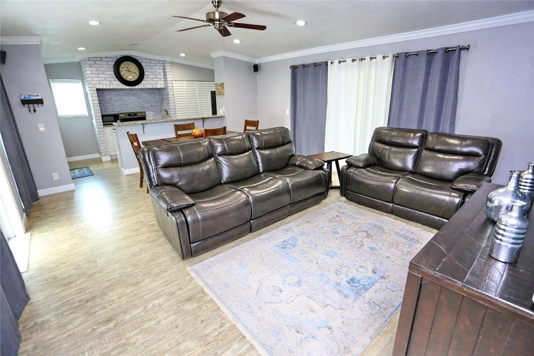 6960 Southwest 1st Street Margate, FL 33068 - Photo 10 of 36 a living room with furniture and a large window