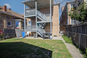 5705 West Higgins Avenue, Unit 2 Chicago, IL 60630 - Photo 11 of 12 a view of front of house with a yard