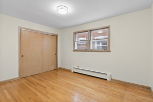 5705 West Higgins Avenue, Unit 2 Chicago, IL 60630 - Photo 6 of 12 an empty room with a workbench