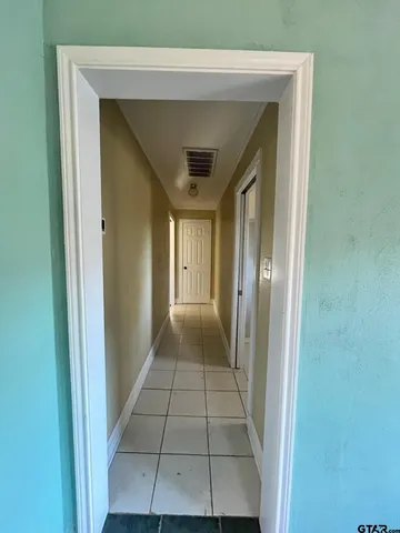 a bathroom with a granite countertop sink mirror and bathtub