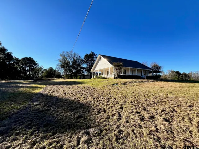 a front view of a house with yard