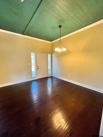 a view of kitchen with wooden floor and electronic appliances