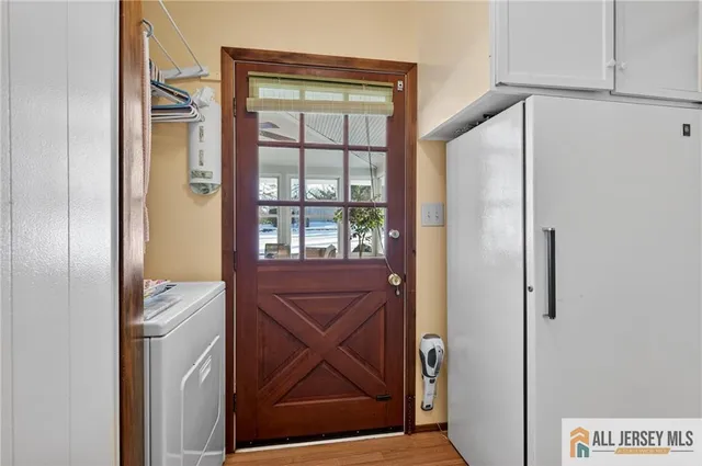 a living room with furniture gym equipment and a chandelier