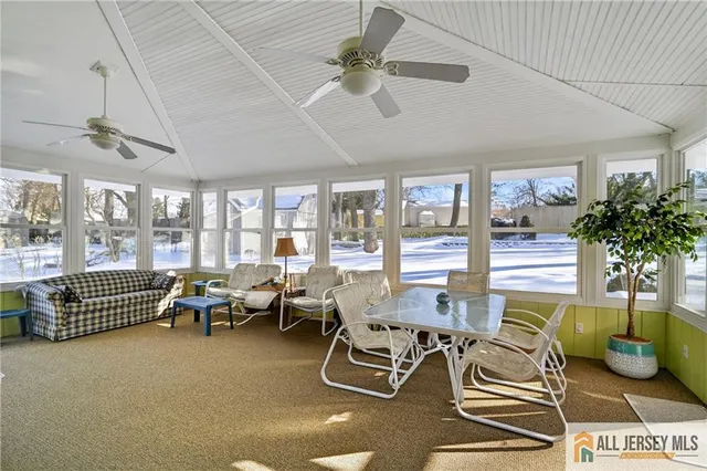 a view of a backyard with sitting area