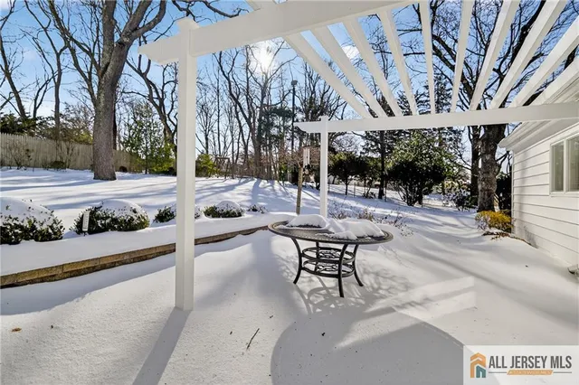 a view of a house with snow on the road