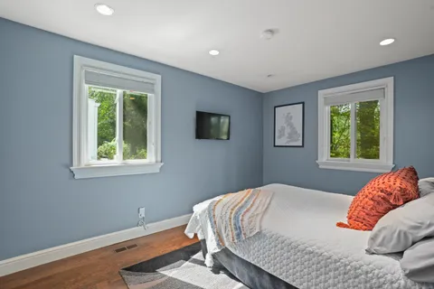 a bedroom with bed and window