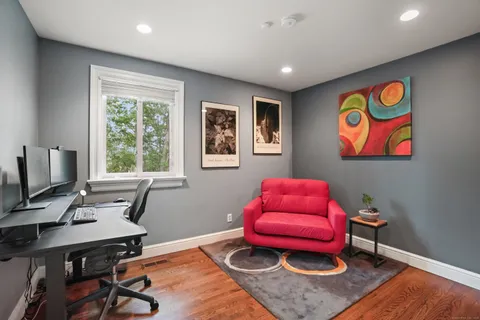 a workspace with furniture and window