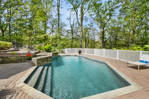 a view of a swimming pool with a patio