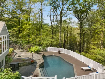a view of a yard with an outdoor seating