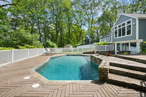 a view of a swimming pool with a patio