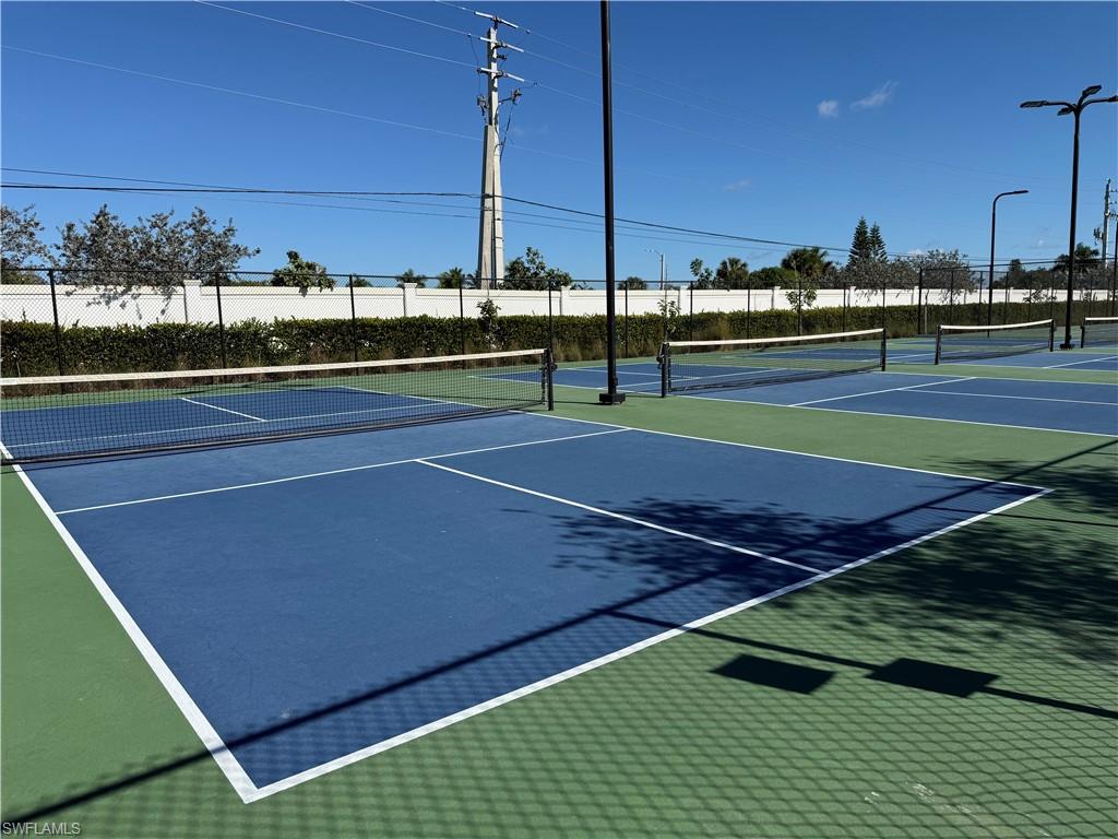 1059 Enbrook Loop Naples, FL 34114 - Photo 15 of 19 View of tennis court with community basketball court