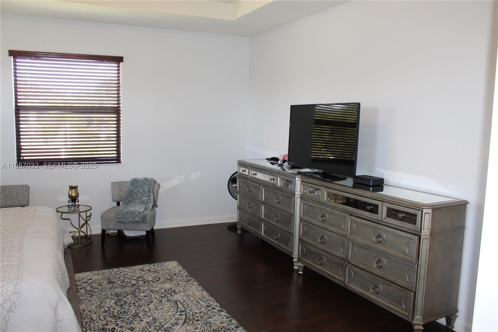 3728 Southeast 5th Court Homestead, FL 33033 - Photo 11 of 26 a living room with furniture and a flat screen tv