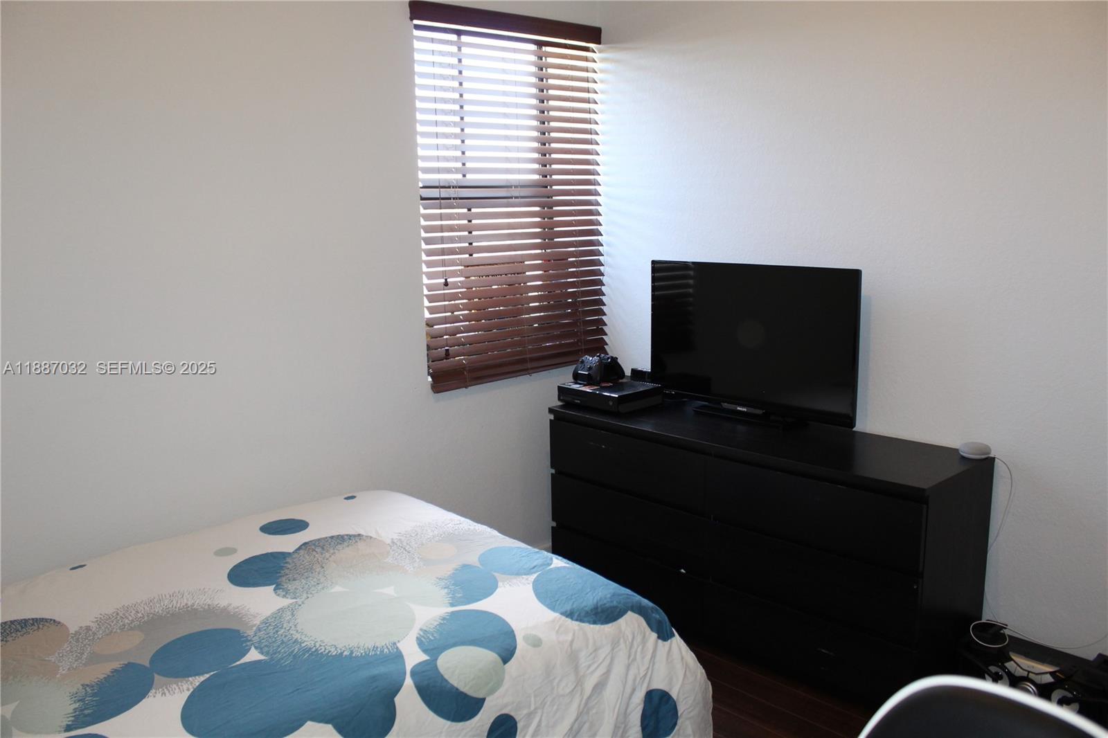 3728 Southeast 5th Court Homestead, FL 33033 - Photo 15 of 26 a bathroom with a sink and a mirror