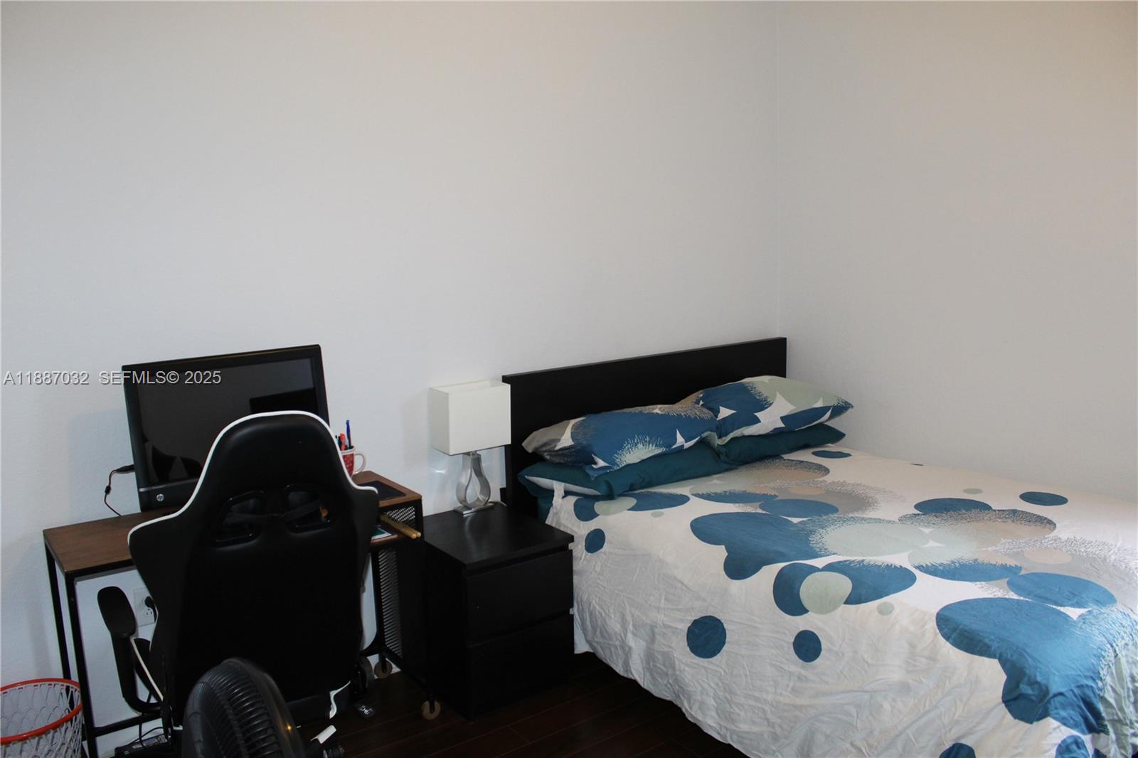 3728 Southeast 5th Court Homestead, FL 33033 - Photo 16 of 26 a living room with a fireplace furniture and a wooden floor