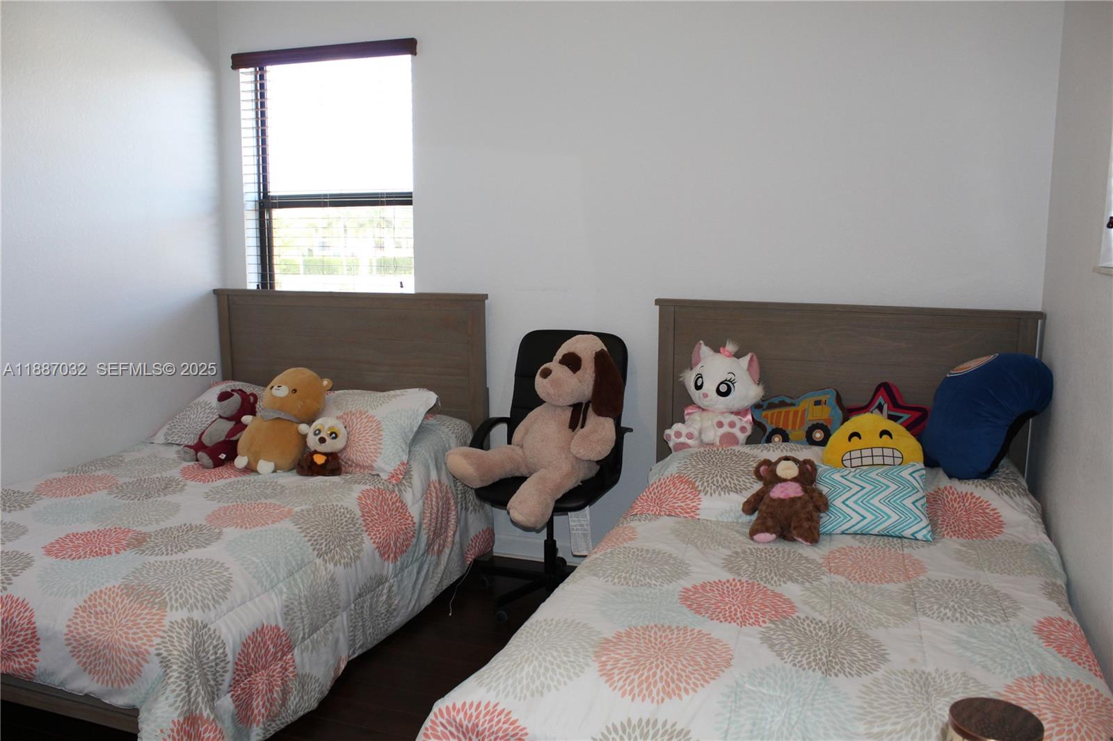 3728 Southeast 5th Court Homestead, FL 33033 - Photo 21 of 26 a bedroom with a bed and window