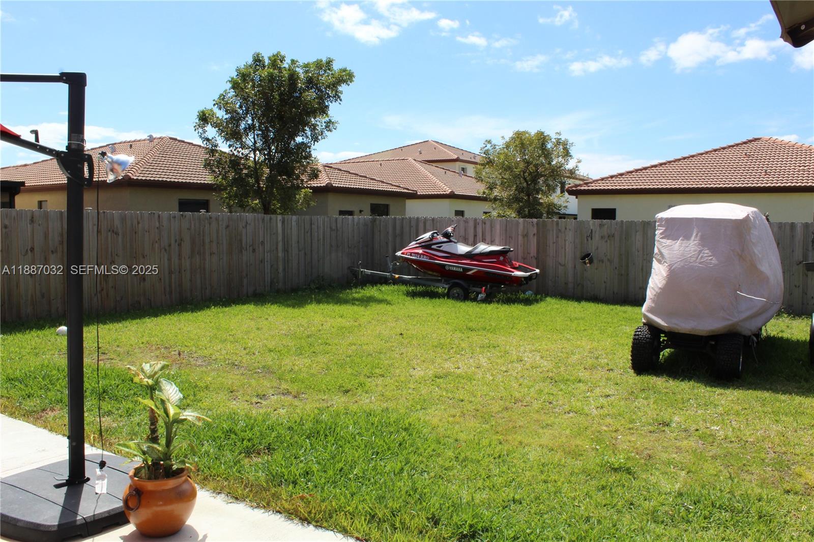 3728 Southeast 5th Court Homestead, FL 33033 - Photo 24 of 26 a backyard of a house with table and chairs