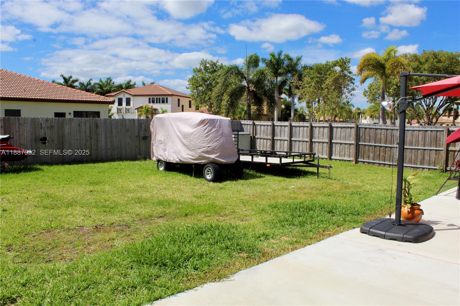 3728 Southeast 5th Court Homestead, FL 33033 - Photo 25 of 26 a view of a backyard with a garden and entertaining space