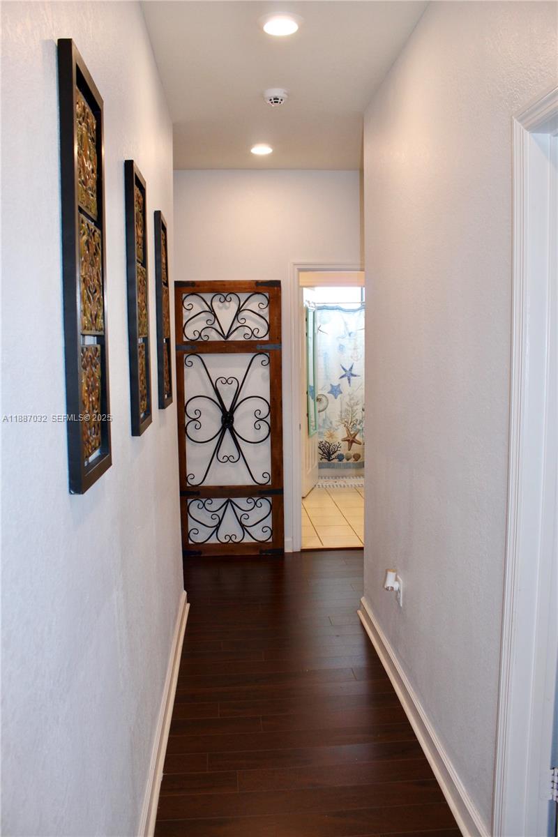 3728 Southeast 5th Court Homestead, FL 33033 - Photo 7 of 26 a view of an entryway with wooden floor
