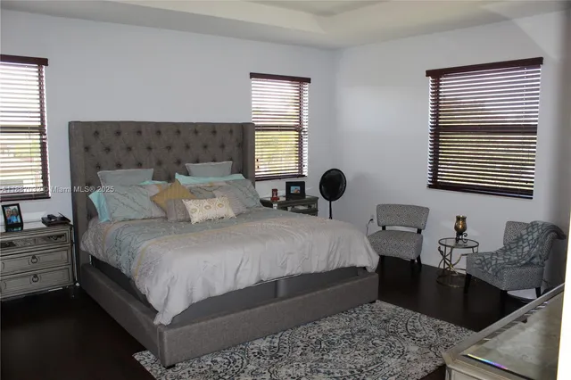 a bedroom with bed and a window