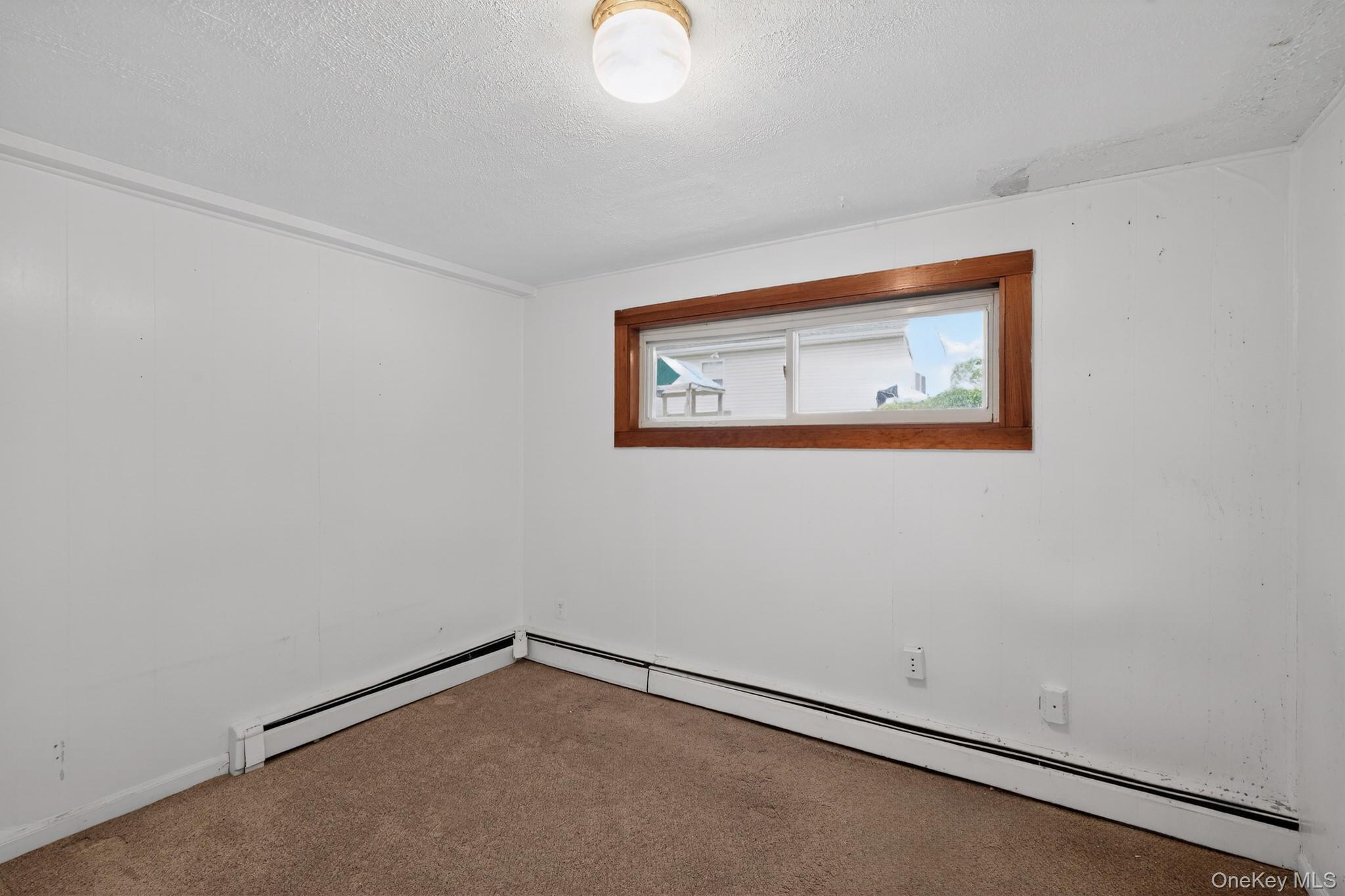 138 Spring Street Massapequa, NY 11758 - Photo 25 of 45 a view of an empty room