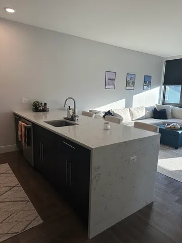 a kitchen with a sink and cabinets