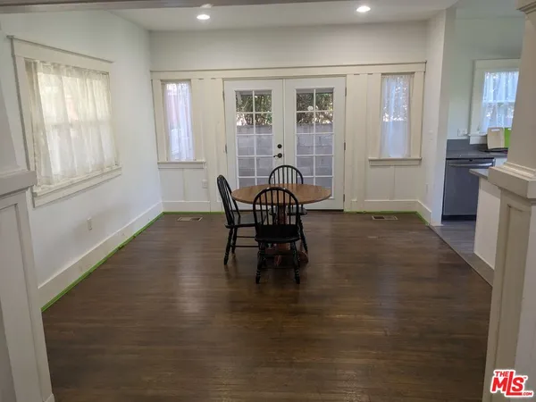a workspace with furniture window and wooden floor