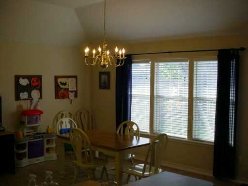 1118 La Mirada Street Portland, TX 78374 - Photo 7 of 10 a view of a dining room with furniture and chandelier