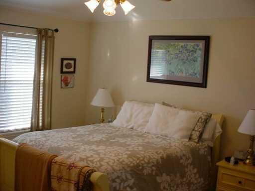 1118 La Mirada Street Portland, TX 78374 - Photo 8 of 10 a bedroom with a bed and a window