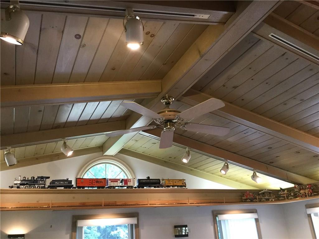 2579 Richard Road Wexford, PA 15090 - Photo 22 of 25 Family Room Ceiling: Wow check out this beautiful knotty pine ceiling with a ceiling fan. Owners made a built in train track that completely runs around the top of the room. Track lighting is a plus. Another powder room is off your family room.