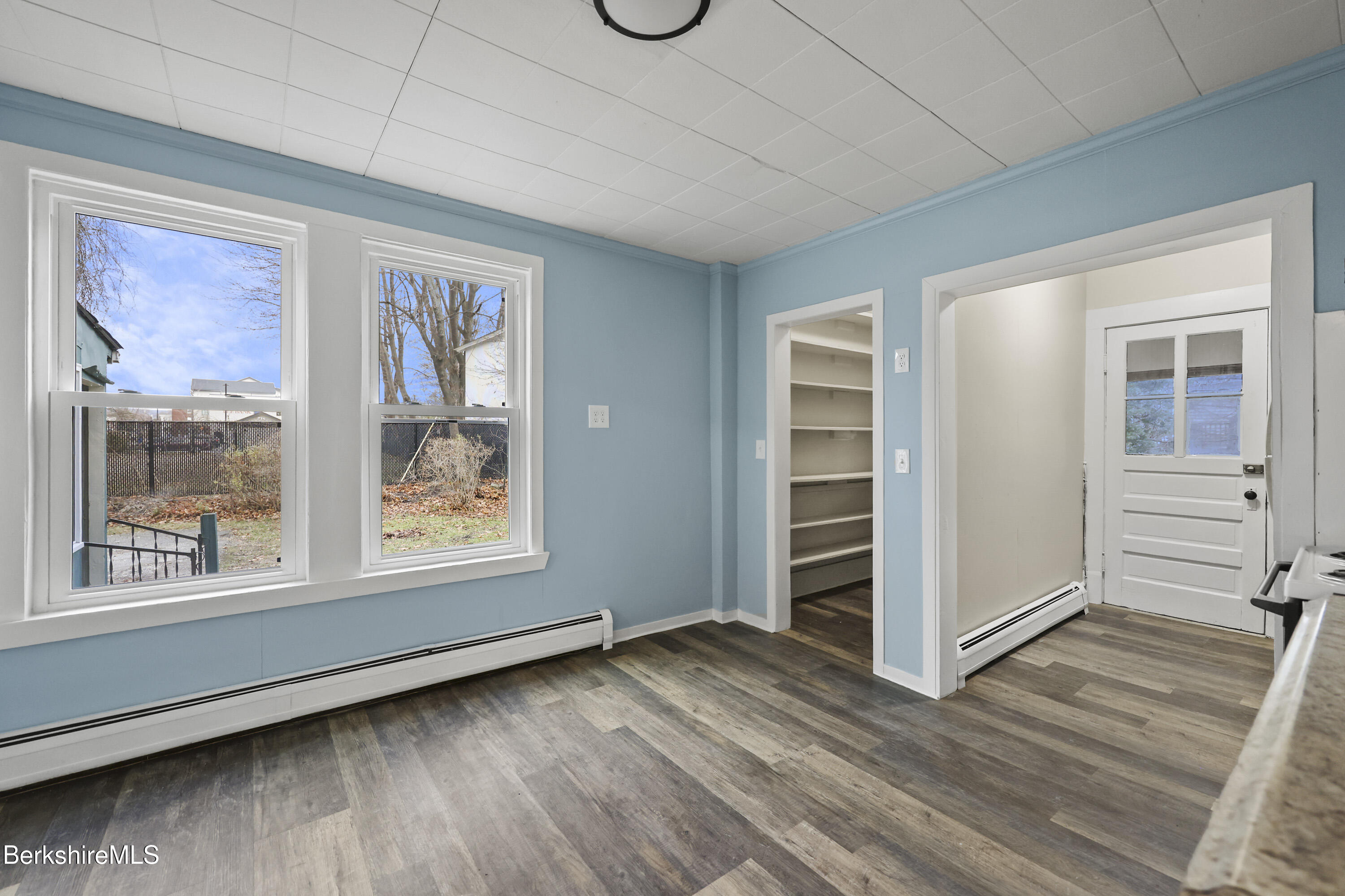 41-43 Reed Street Pittsfield, MA 01201 - Photo 14 of 56 a view of an empty room with a window and wooden floor