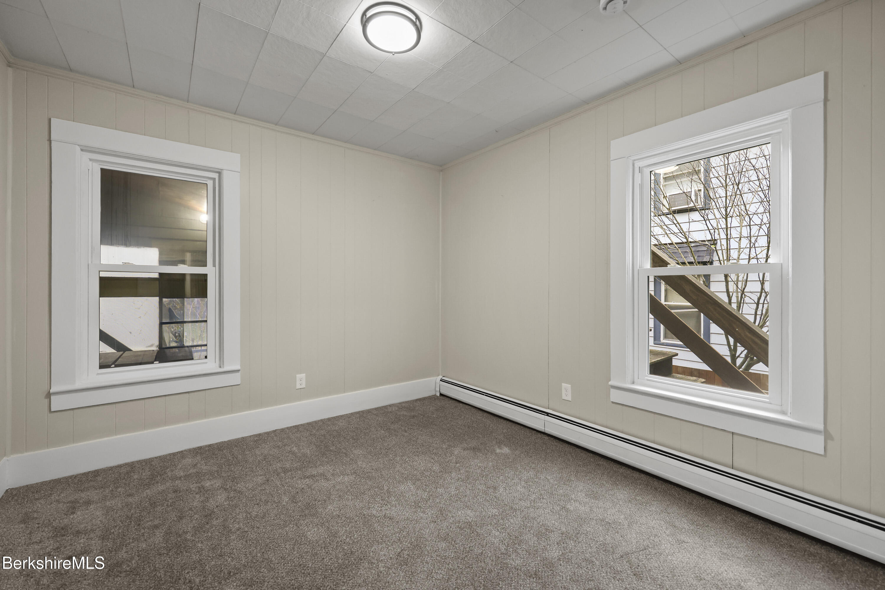 41-43 Reed Street Pittsfield, MA 01201 - Photo 17 of 56 an empty room with windows