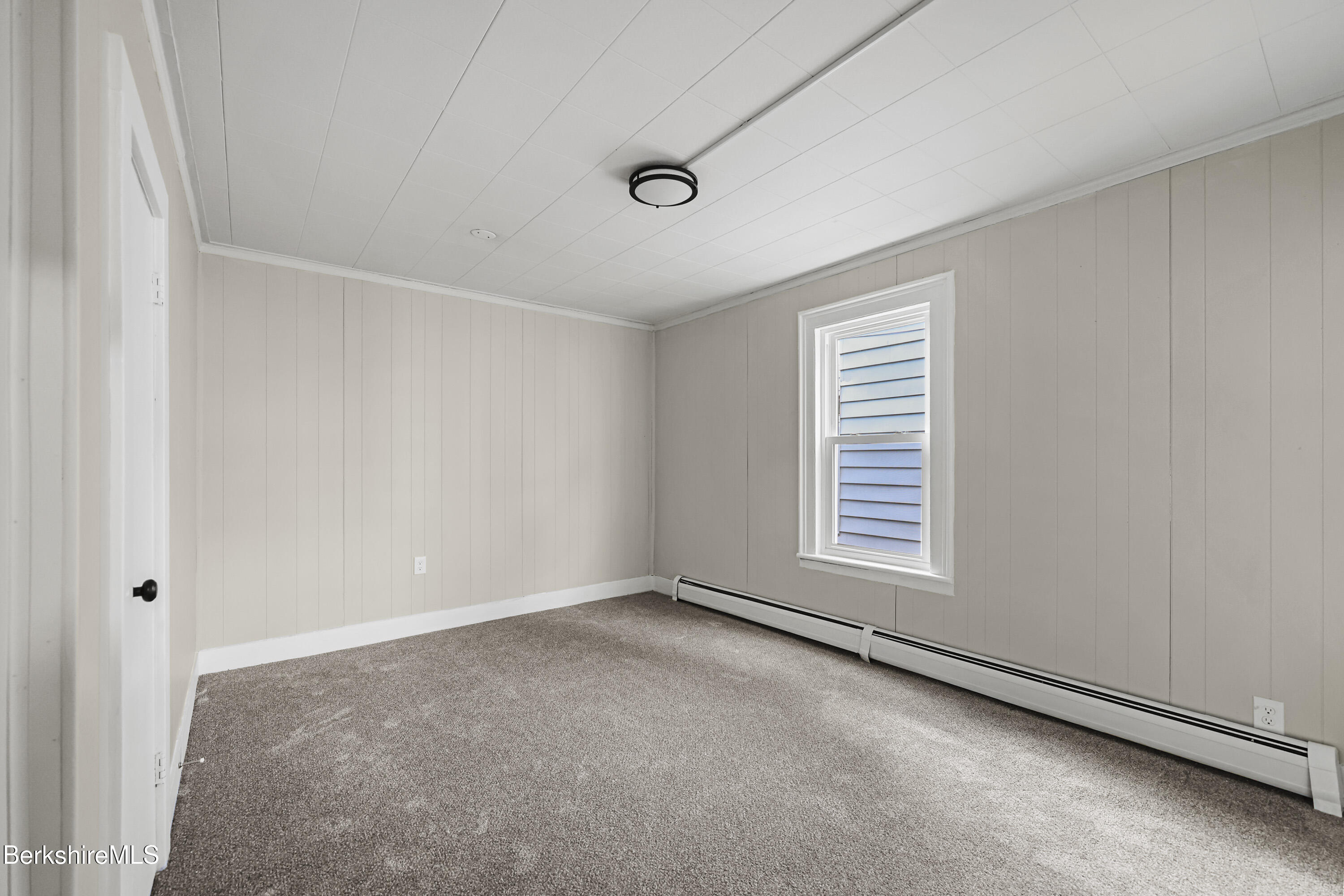 41-43 Reed Street Pittsfield, MA 01201 - Photo 19 of 56 a view of an empty room with a window