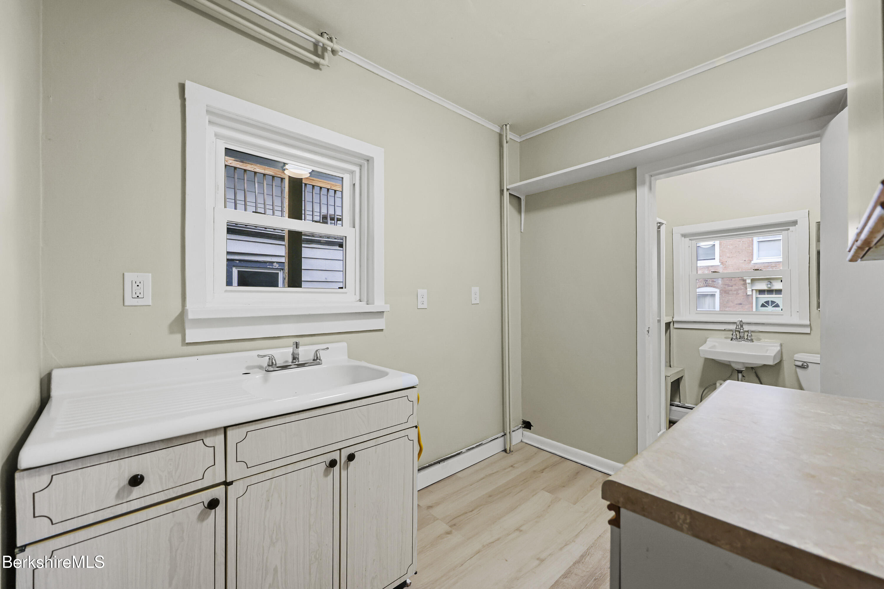 41-43 Reed Street Pittsfield, MA 01201 - Photo 23 of 56 a bathroom with a sink a vanity and a mirror