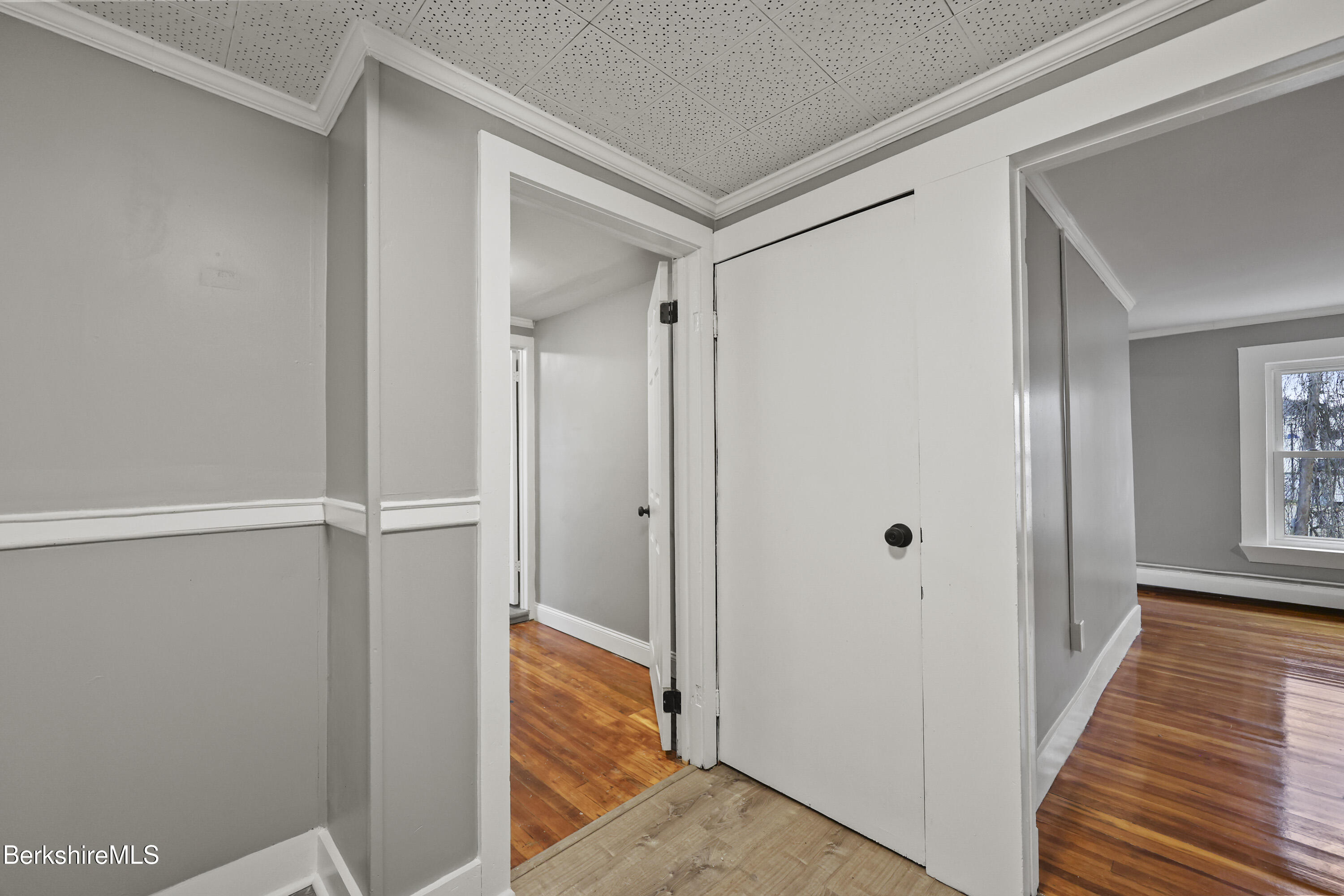 41-43 Reed Street Pittsfield, MA 01201 - Photo 27 of 56 a view of a hallway with wooden floor and closet
