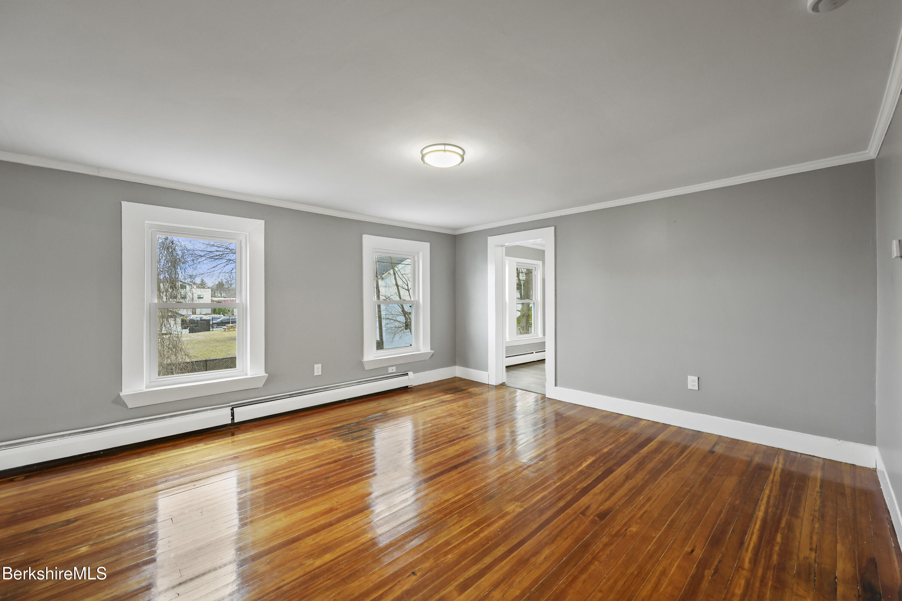 41-43 Reed Street Pittsfield, MA 01201 - Photo 28 of 56 an empty room with wooden floor and windows