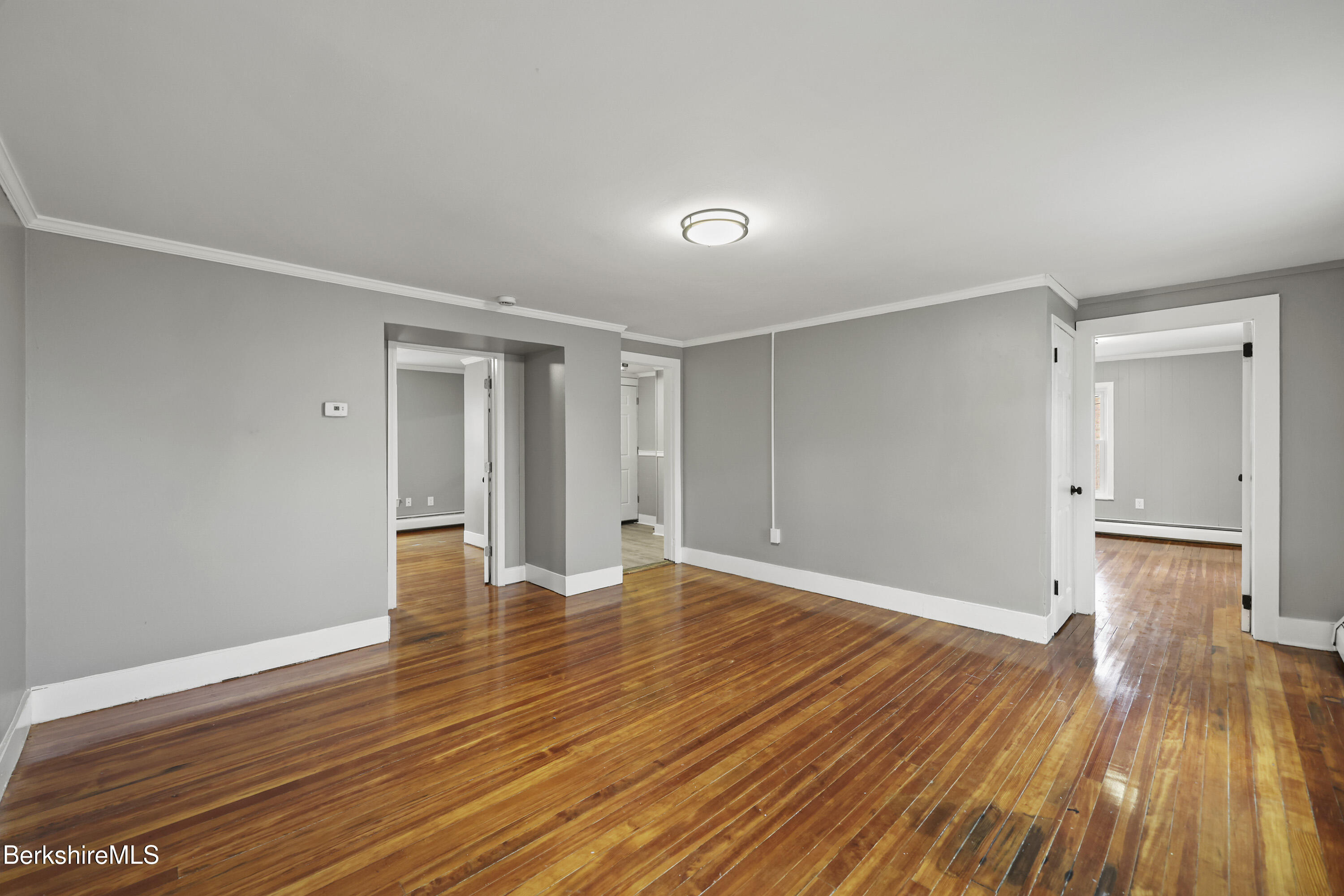 41-43 Reed Street Pittsfield, MA 01201 - Photo 30 of 56 a view of empty room with wooden floor and entryway