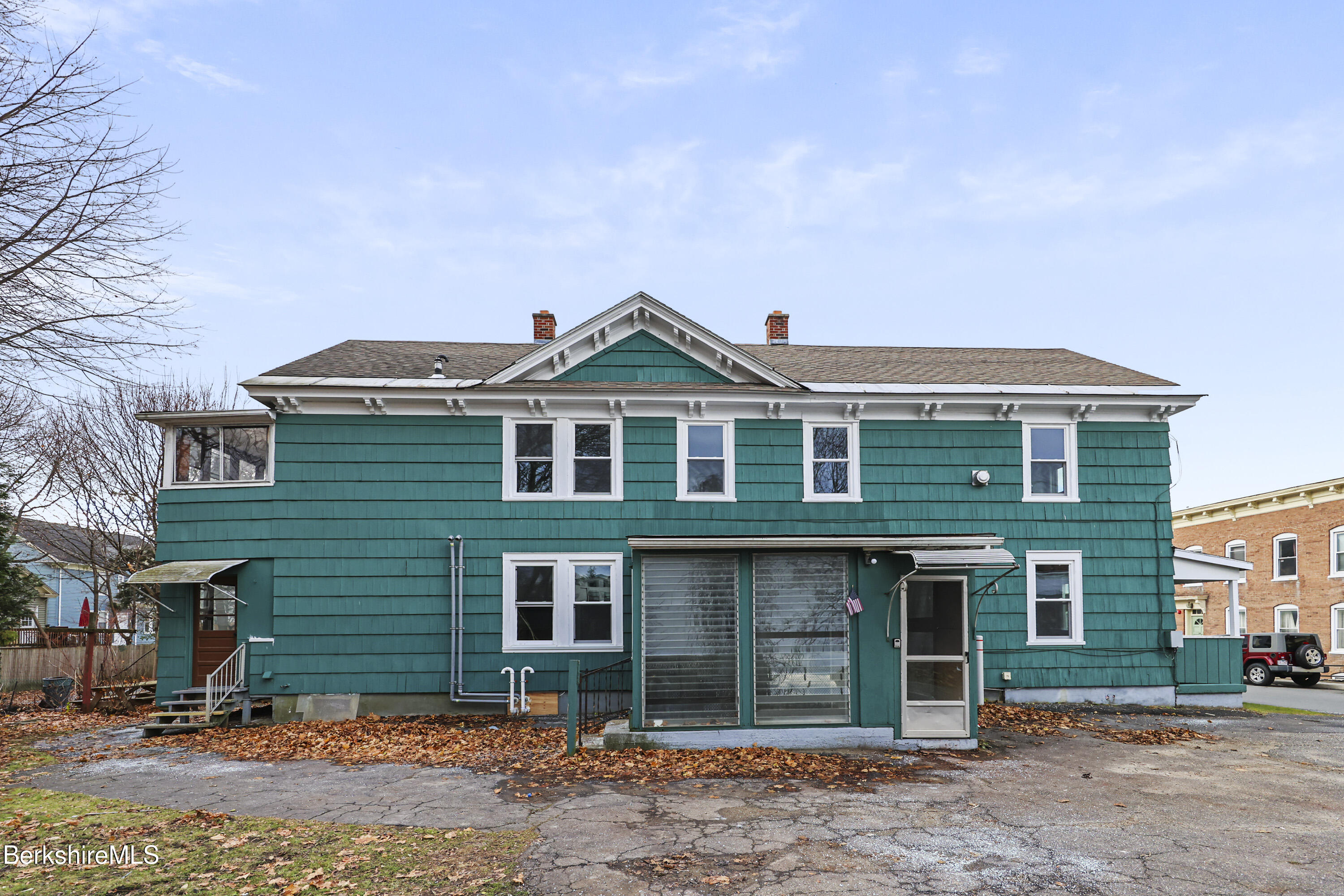 41-43 Reed Street Pittsfield, MA 01201 - Photo 3 of 56 a front view of a house with garden
