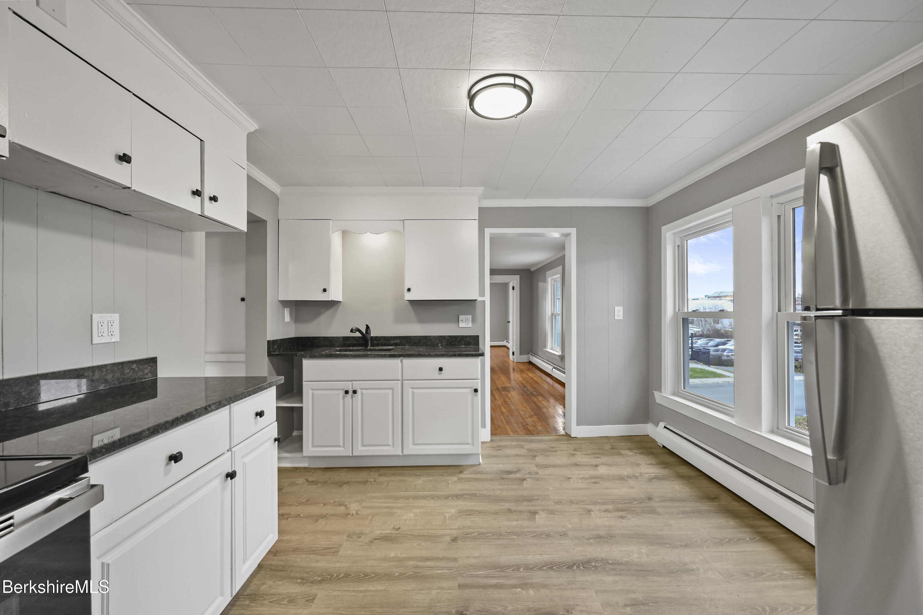 41-43 Reed Street Pittsfield, MA 01201 - Photo 34 of 56 a large kitchen with a refrigerator and a sink