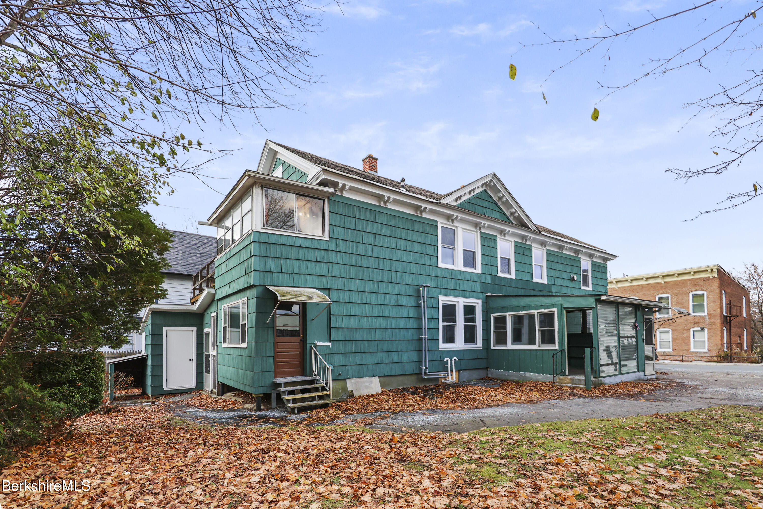41-43 Reed Street Pittsfield, MA 01201 - Photo 4 of 56 a front view of a house with a yard
