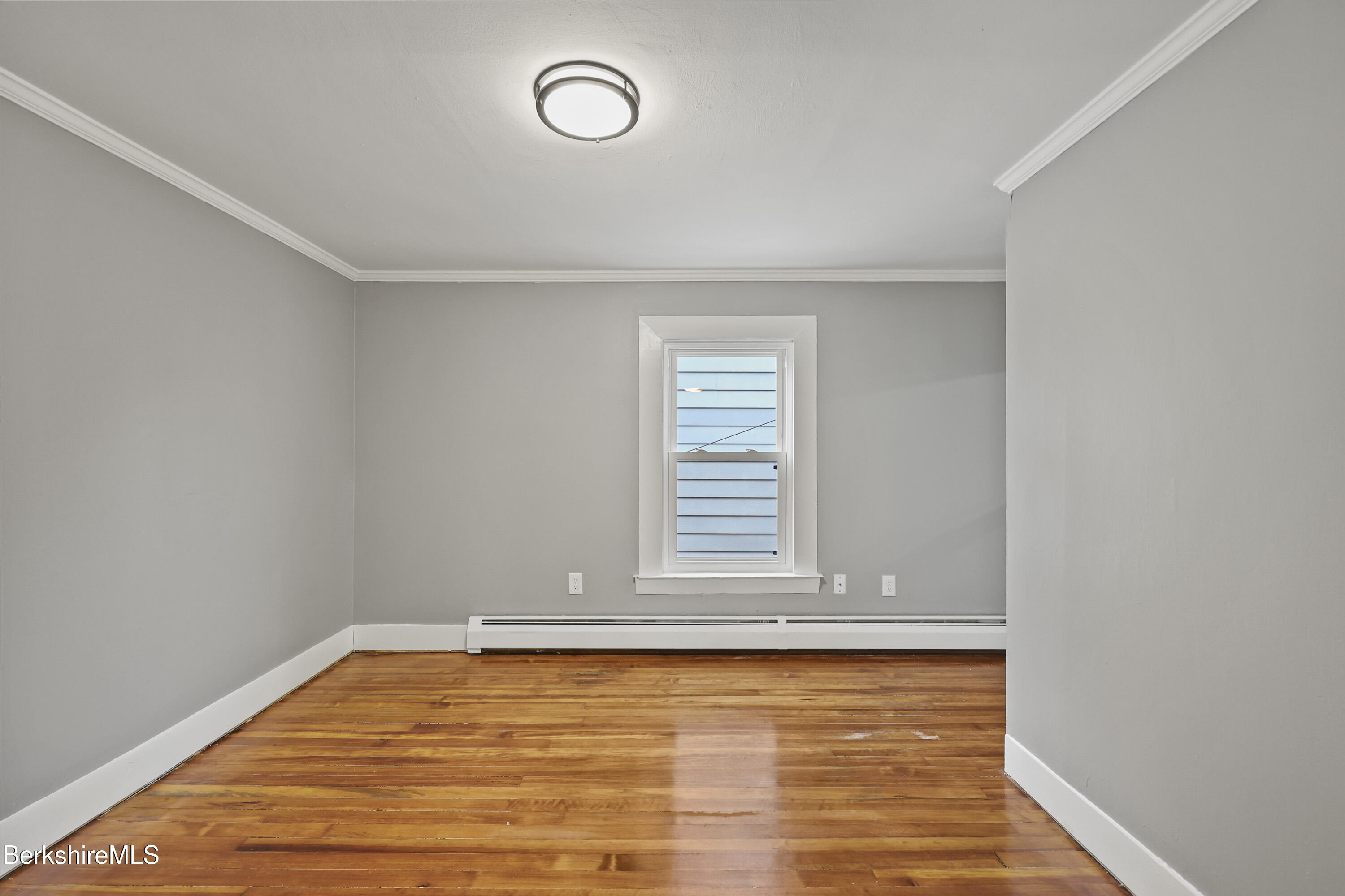41-43 Reed Street Pittsfield, MA 01201 - Photo 41 of 56 a view of a room with wooden floor and window