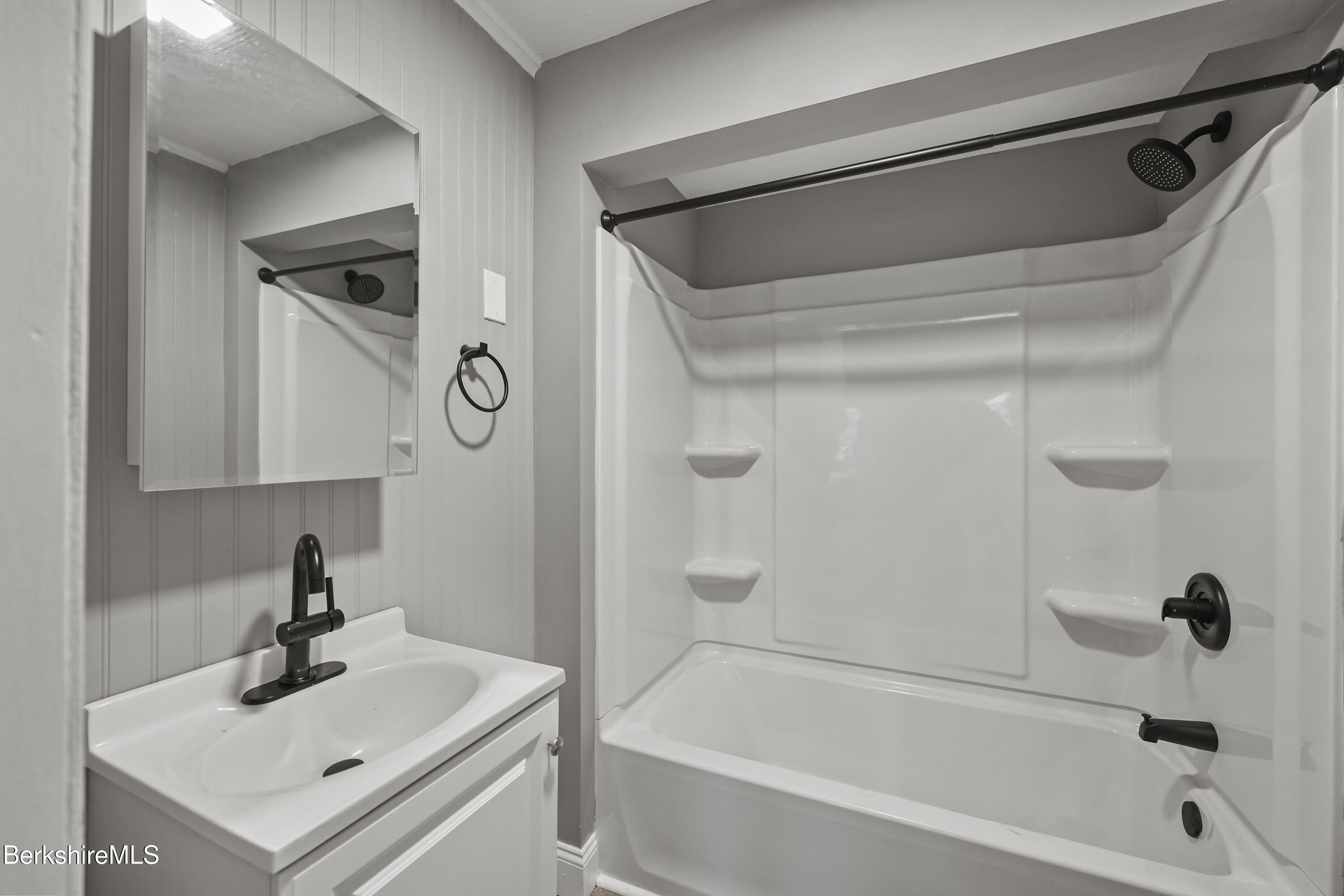 41-43 Reed Street Pittsfield, MA 01201 - Photo 45 of 56 a bathroom with a sink a shower and a mirror