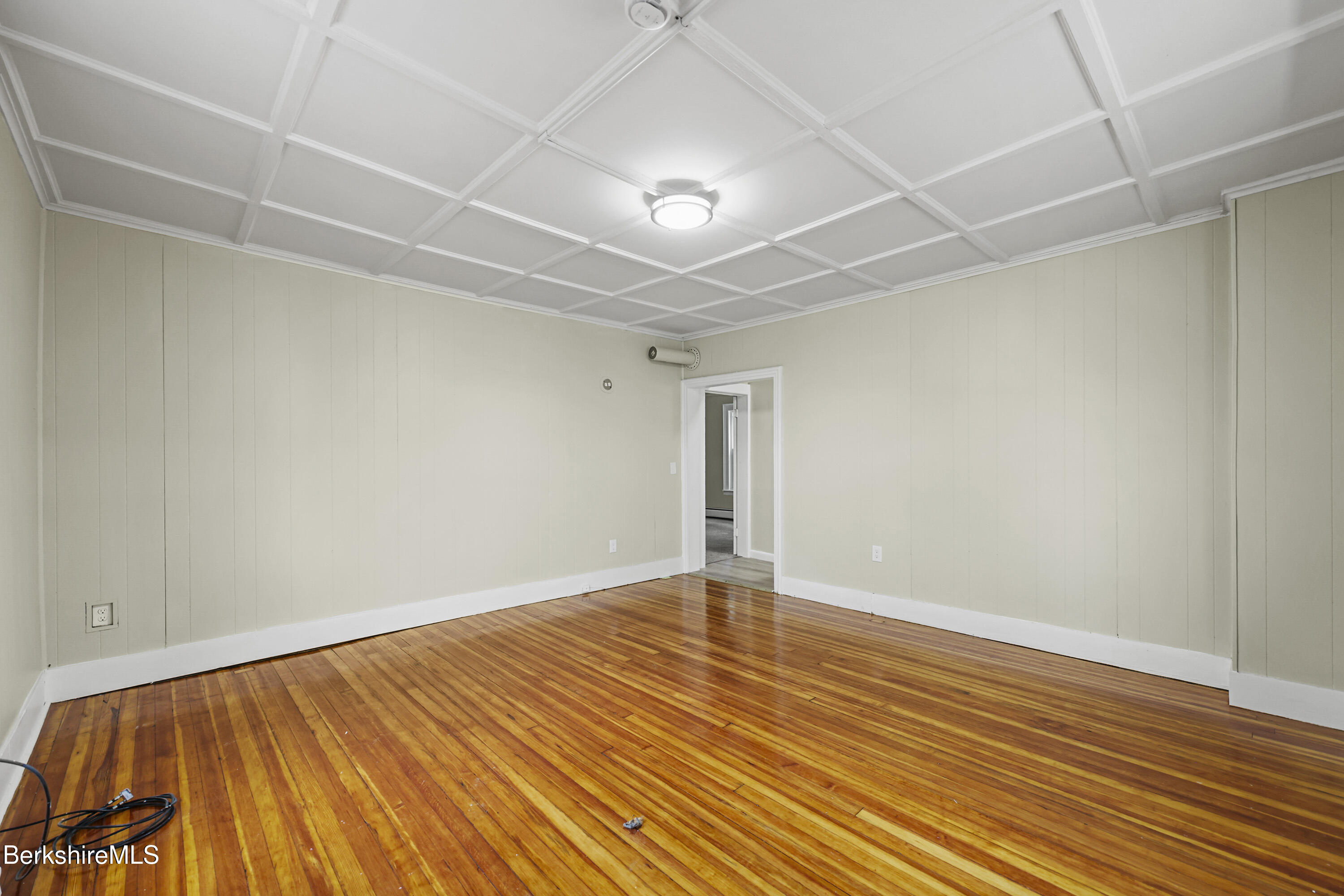 41-43 Reed Street Pittsfield, MA 01201 - Photo 5 of 56 a view of an empty room with wooden floor