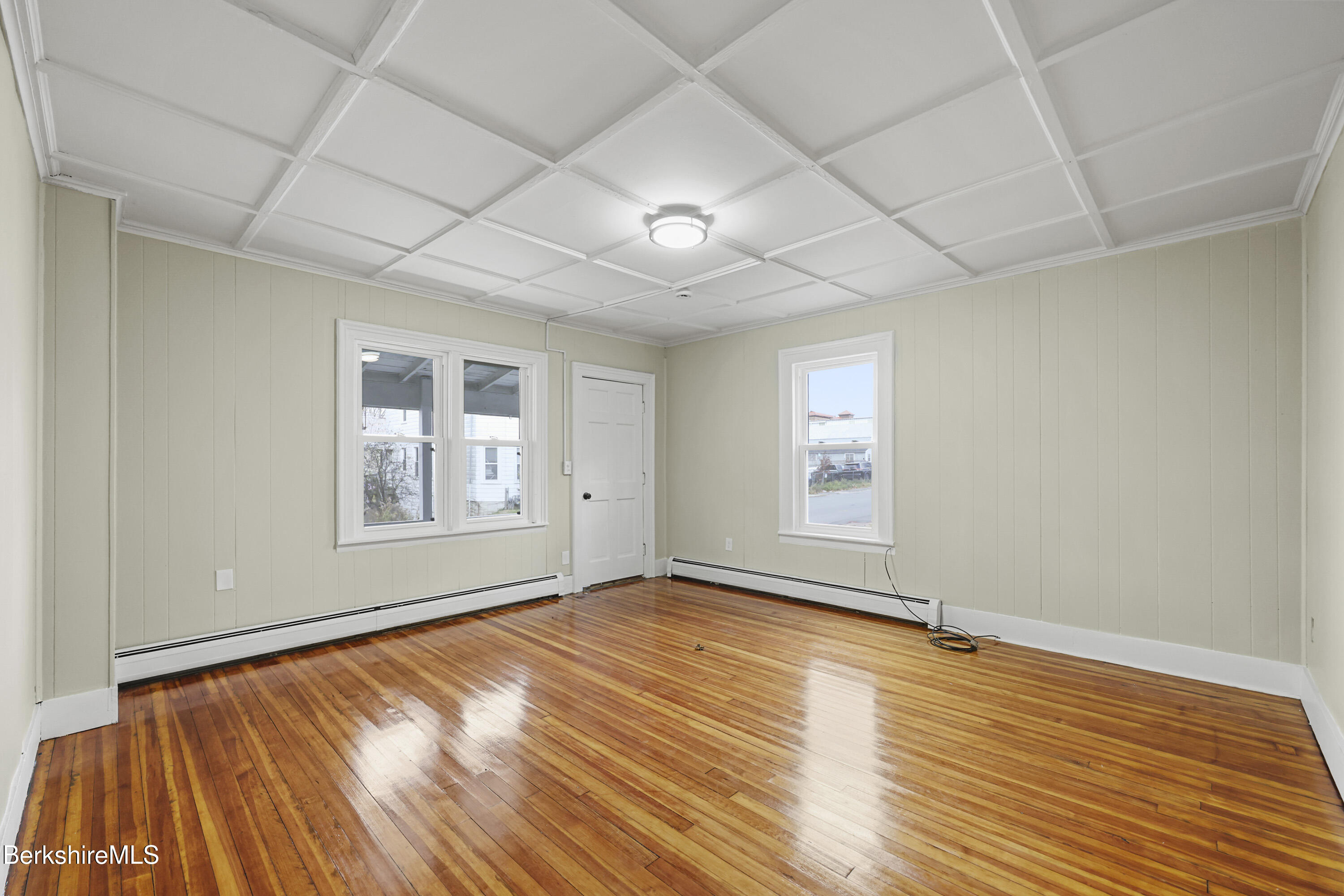 41-43 Reed Street Pittsfield, MA 01201 - Photo 7 of 56 a view of an empty room with wooden floor and a window